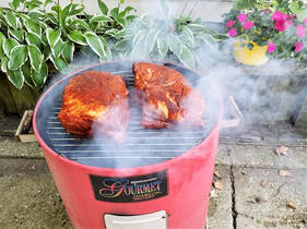 Pork shoulders early in the smoking process