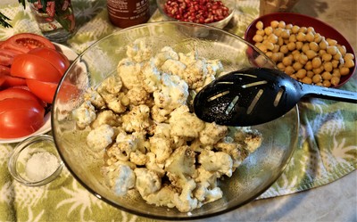 Warm Spiced Cauliflower with Chickpeas and Pomegranate Seeds - toss cauliflower in spices and oil